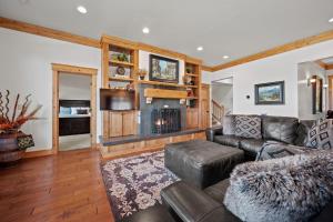 a living room with a leather couch and a television at Powder Mtn Trapper Lodge TR1 Ski Retreat Game Rm in Eden +68 photos