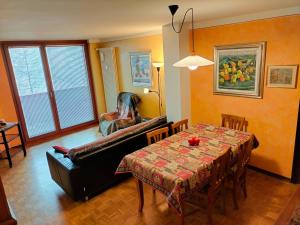 a living room with a table and a couch at Casa Elvezia in Breuil-Cervinia