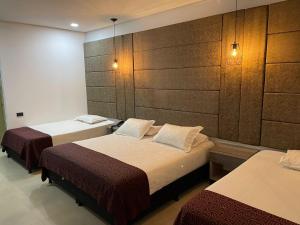 Postel nebo postele na pokoji v ubytování Hotel Merlott 70