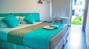 Llit o llits en una habitació de Concept Design Hostel & Suites