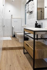 a bathroom with a sink and a bath tub at House Bossa in Nocera Inferiore +26 photos