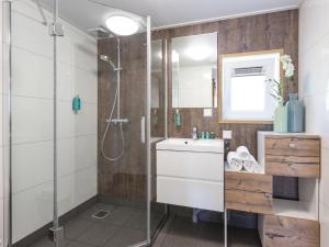 a bathroom with a shower and a sink at Thatched Home in Overijssel in De Bult +32 photos