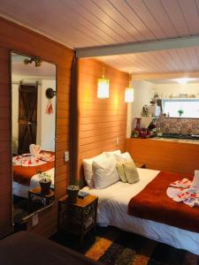 Postel nebo postele na pokoji v ubytování Petite House com Hidromassagem + 24 fotografií