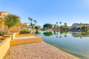 a body of water with houses and palm trees at Half-Mi to Dtwn Lakefront Gilbert Home! in Gilbert
