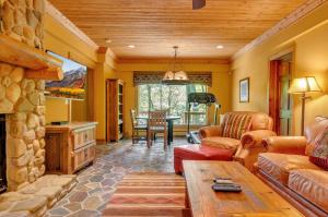 a living room with a couch and a table at Spacious Chalet Hot Tub Sauna Holiday Valley in Ellicottville