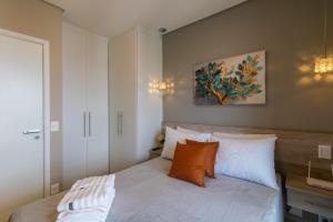 Postel nebo postele na pokoji v ubytování Uptown Apartament - GRU 2202