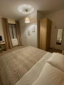 a bedroom with a large bed in a room at Il Giardino Segreto in Assisi +23 photos