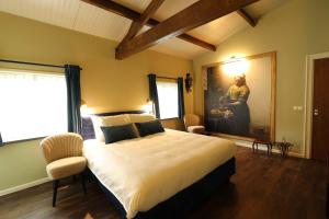 Postel nebo postele na pokoji v ubytování B&B Eemswolde