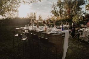 a table set up for a wedding in the garden at Chateau de la Vieille Chapelle in Lugon et l’Ile du Carney