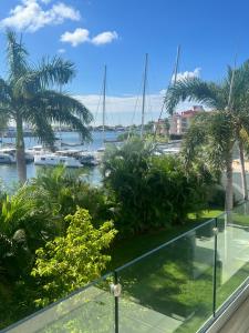 a view of the marina from the balcony at Very luxury Waterfront apartment at Las Brisas in Koolbaai