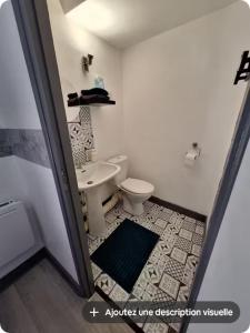 a bathroom with a white toilet and a sink at Notre chez nous pour vous in Fourchambault +7 photos