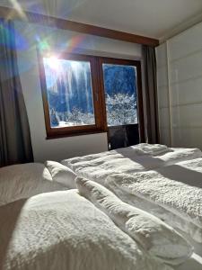 A bed or beds in a room at Pension Baranekhof - accommodation in nature - Baranek Resorts