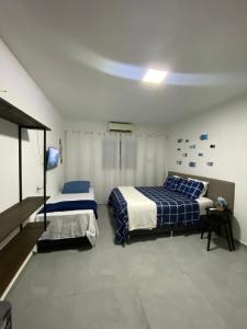 Postel nebo postele na pokoji v ubytování Pousada Tamatoa