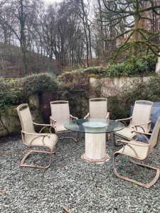 a group of four chairs and a table and a table and chairs at Lovely 2 bed house in Hawkshead in Hawkshead