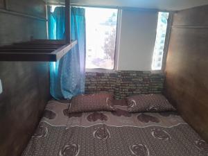 Una cama o camas en una habitación de Petra inbox Hostel