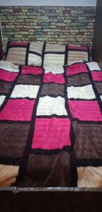 Una cama o camas en una habitación de Petra inbox Hostel
