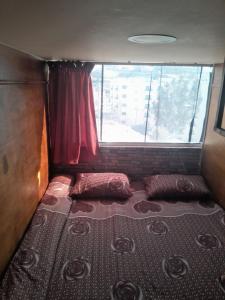 Una cama o camas en una habitación de Petra inbox Hostel