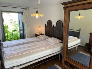 Postel nebo postele na pokoji v ubytování Rustico Amorini by Fewotessin