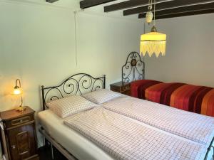 Postel nebo postele na pokoji v ubytování Rustico Amorini by Fewotessin