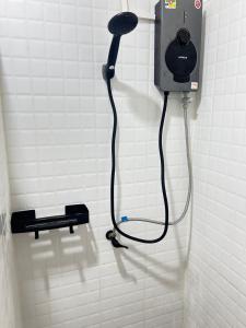 a shower in a bathroom with a hair dryer at ร เรือ รีสอร์ท in Ban Khao Noi +10 photos
