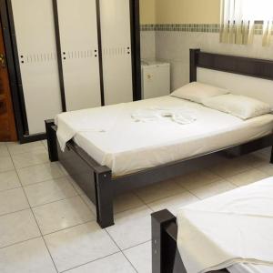 Postel nebo postele na pokoji v ubytování Hotel Plaza Lampião