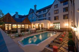 a swimming pool in front of a building at Grand Bohemian Mountain Brook, Autograph Collection in Birmingham