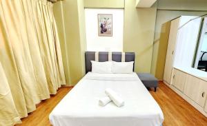 Ένα ή περισσότερα κρεβάτια σε δωμάτιο στο Holiday Hostel KLCC