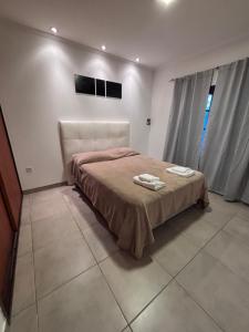 Ένα ή περισσότερα κρεβάτια σε δωμάτιο στο Aires de Areco