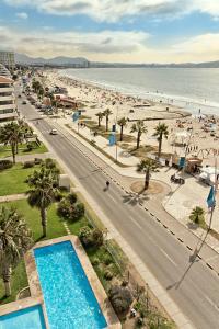 an aerial view of a beach with a swimming pool at Terrazas del sol IV in La Serena