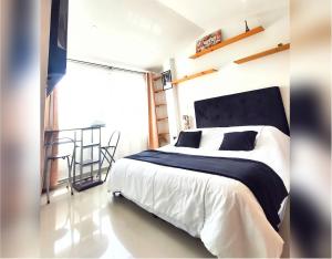 Postel nebo postele na pokoji v ubytování HABITACIÓN AMPLIA y CÓMODA CON BAÑO PRIVADO