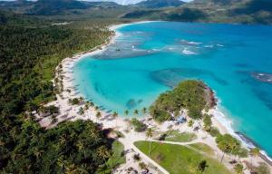 an aerial view of a beach with blue water at Atabeba in Las Galeras