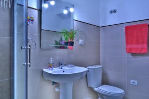 a bathroom with a sink and a toilet and a shower at Casa Yoel in Granadilla de Abona +52 photos