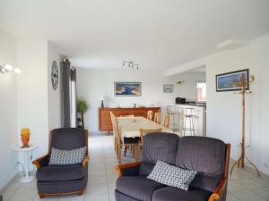 a kitchen and dining room with a table and chairs at Erdeven - Maison lumineuse 5 pièces avec jardin fermé - FR-1-479-188 in Erdeven