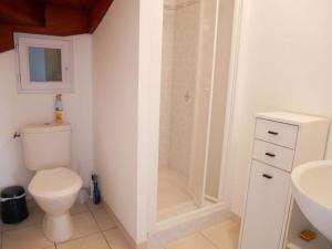 a bathroom with a shower and a toilet and a sink at Erdeven - Maison lumineuse 5 pièces avec jardin fermé - FR-1-479-188 in Erdeven +7 photos