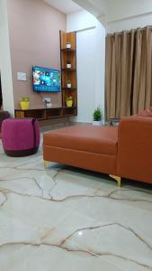 Μια τηλεόραση ή/και κέντρο ψυχαγωγίας στο Eve Service apartment +7 φωτογραφίες