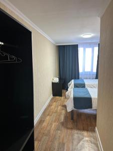 Postel nebo postele na pokoji v ubytování Ayan Hotel