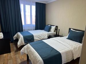 Postel nebo postele na pokoji v ubytování Ayan Hotel