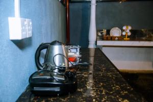 a tea kettle on top of a counter at Villa Number 6 in Weligama
