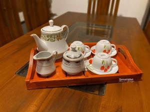 a tray with a tea set on a table at Villa Number 6 in Weligama