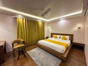 Ένα ή περισσότερα κρεβάτια σε δωμάτιο στο Luxe Haven Residency