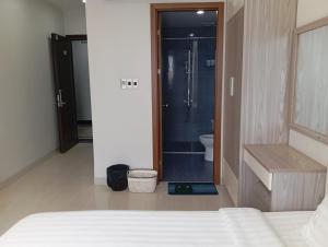 Postel nebo postele na pokoji v ubytování TQ2 Hotel & Apartment