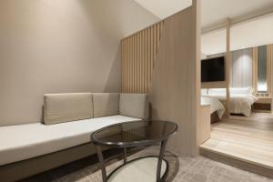Ένα ή περισσότερα κρεβάτια σε δωμάτιο στο Gamalan Breeze Hotel