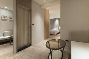 Ένα ή περισσότερα κρεβάτια σε δωμάτιο στο Gamalan Breeze Hotel