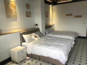 Cama o camas de una habitación en Stroll at Wudao Inn
