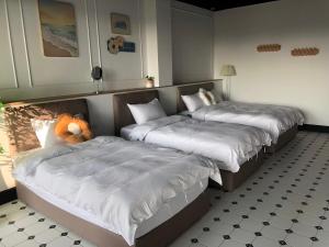 Cama o camas de una habitación en Stroll at Wudao Inn