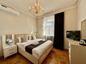 Postel nebo postele na pokoji v ubytování Santa Villa Hotel