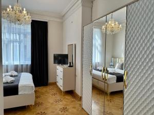 Postel nebo postele na pokoji v ubytování Santa Villa Hotel