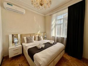 Postel nebo postele na pokoji v ubytování Santa Villa Hotel