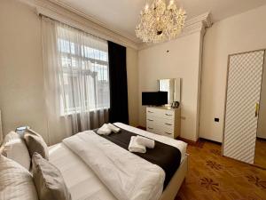 Postel nebo postele na pokoji v ubytování Santa Villa Hotel