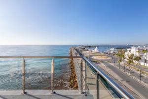 a view of the ocean from a balcony at INNSiDE by Meliá Alicante Porta Maris in Alicante
